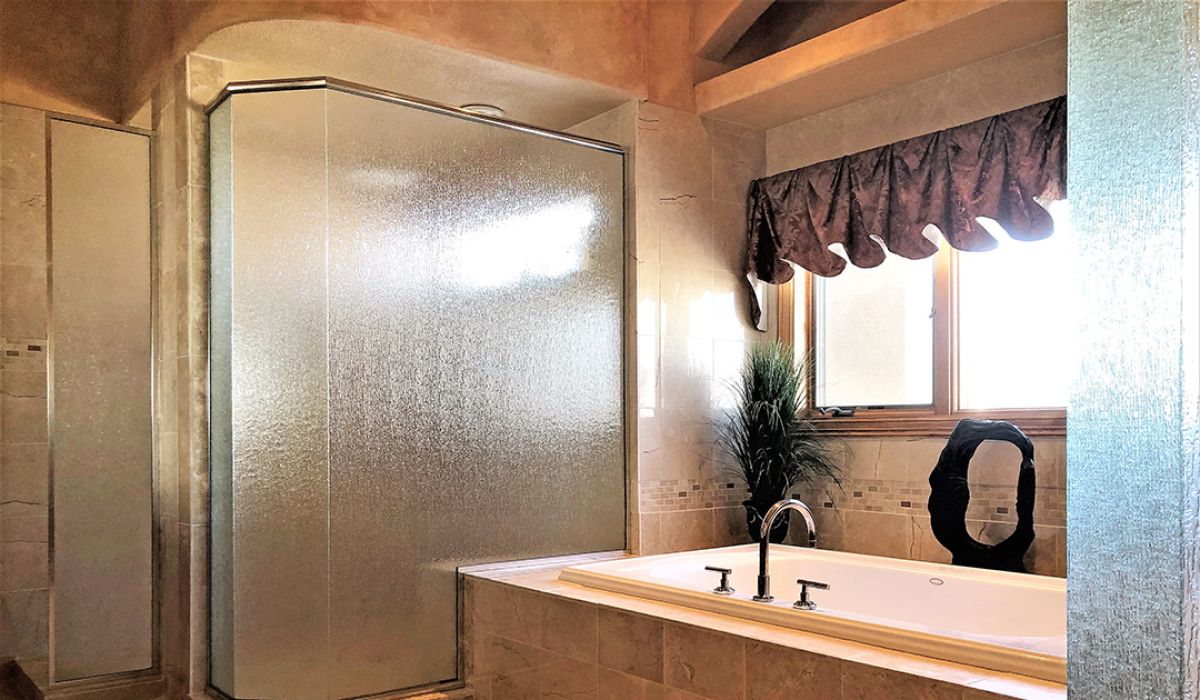 Bathroom remodel, shower glass enclosure with a jacuzzi tub.